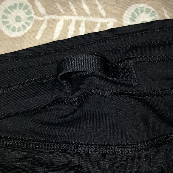Two pairs of black Lulu Lemon shorts, size medium. - Picture 8 of 9